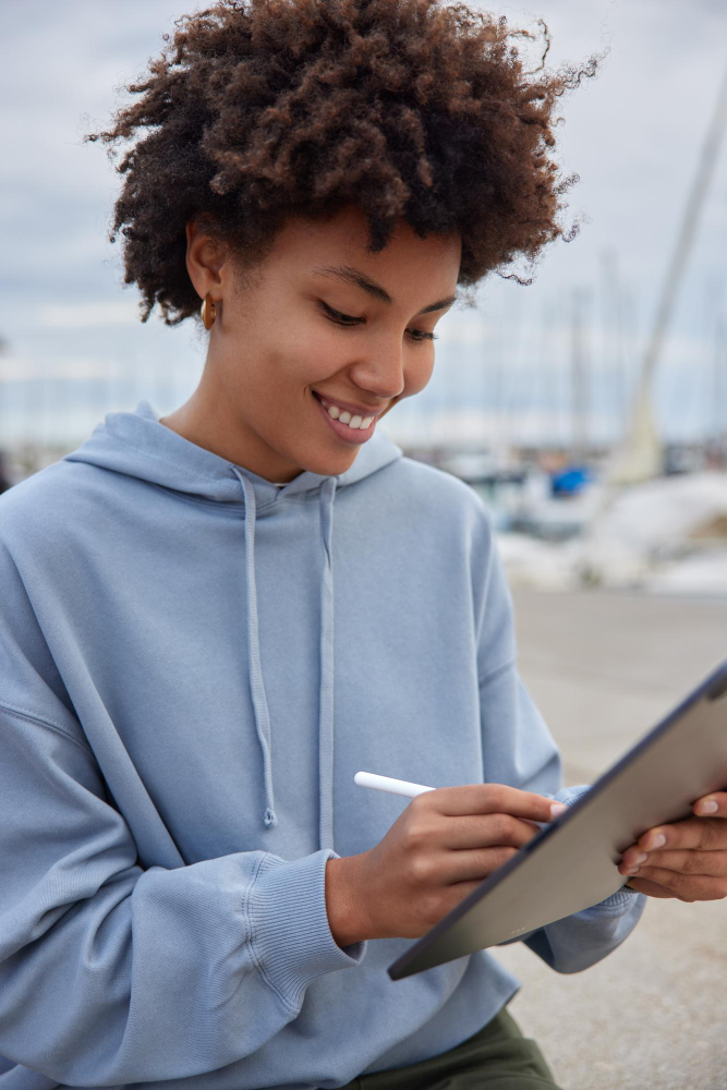 Person signing a document on a tablet from anywhere